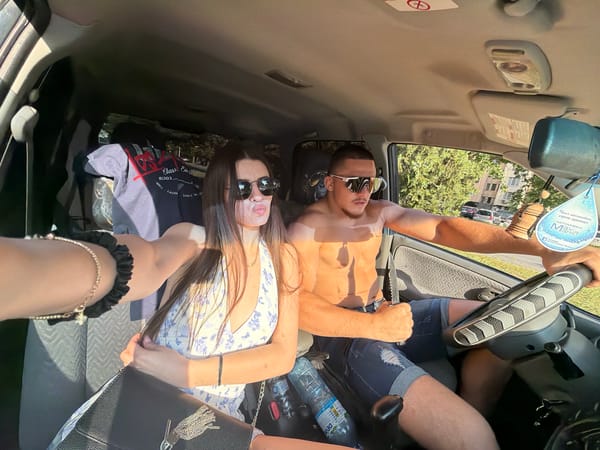 Woman takes selfie in passenger seat during daylight in Plovdiv