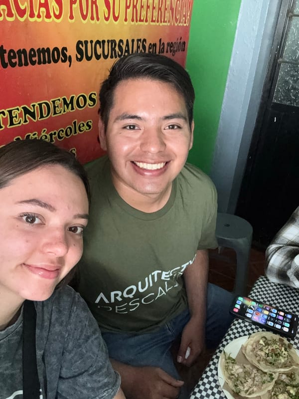 Couple takes selfie at restaurant in Cuetzalan, Mexico