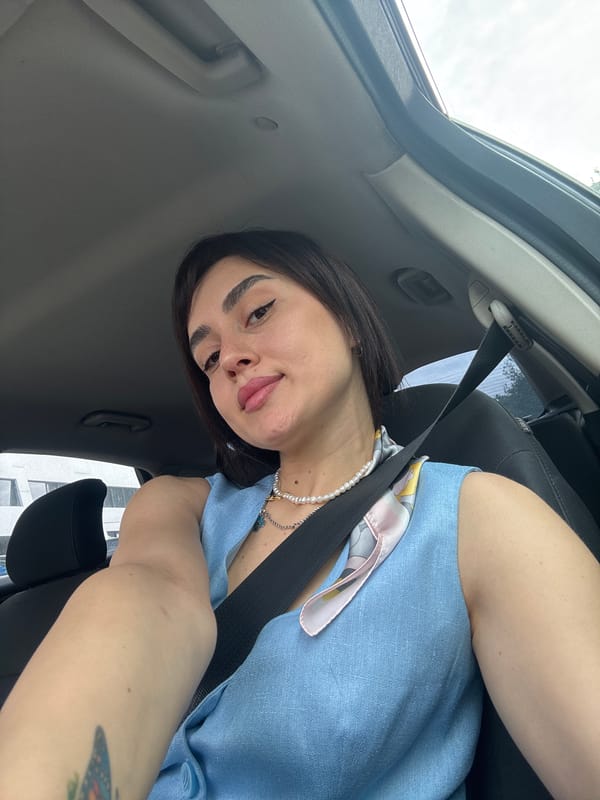 Woman photographed in car driver's seat in Tbilisi