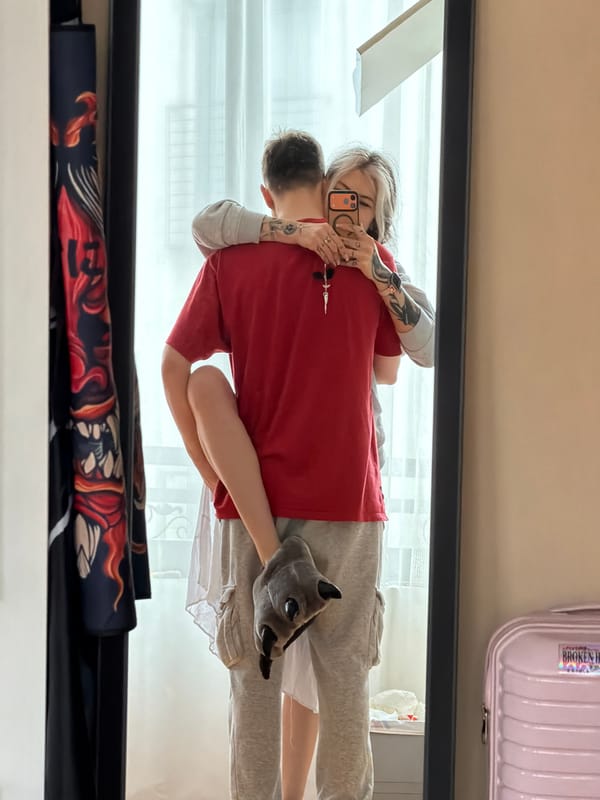 Two people share intimate moment in Budva mirror selfie
