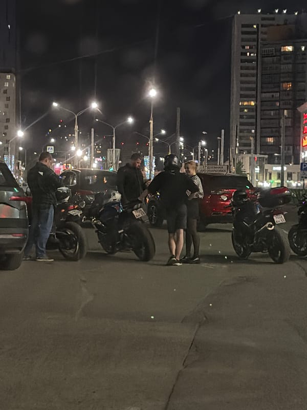 Nighttime street scenes and vehicle displays captured in Perm