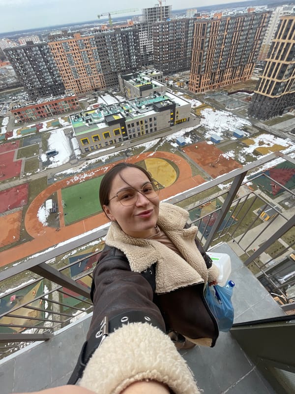 Woman takes elevated selfie overlooking Balashikha residential area