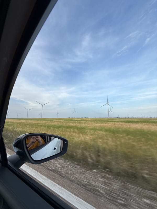 Rural Spain wheat fields documented with wind turbines backdrop