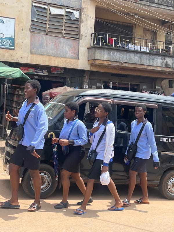 Street life and commerce along a busy Nkpor road