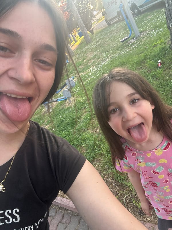 Adult and child share playful moments in Resen, Bulgaria