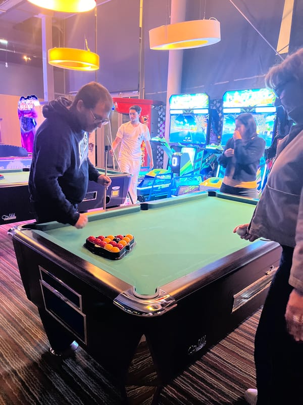 Evening arcade gaming session captured in Montrond-les-Bains entertainment venue