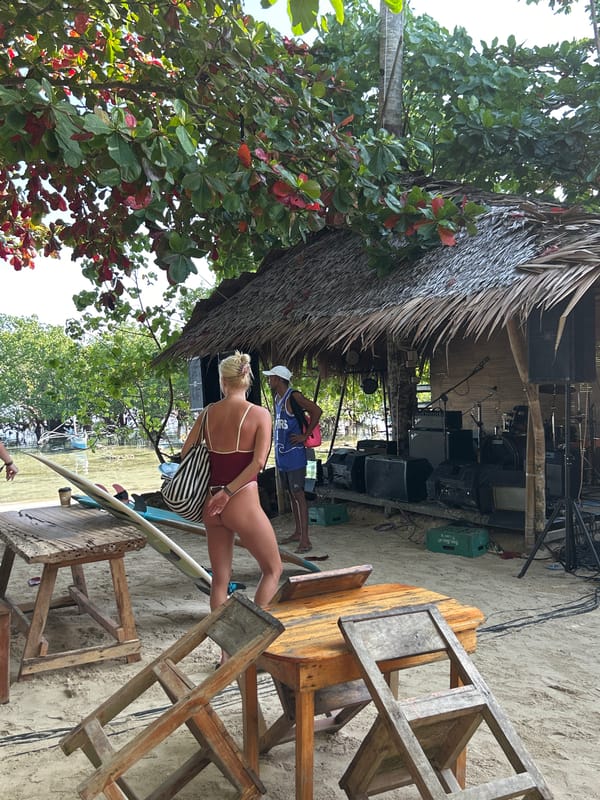 Beachfront surfboard storage captured in General Luna, Philippines