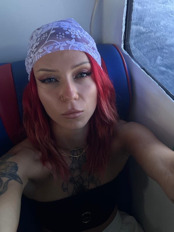 Woman takes selfie in vehicle near Nusa Penida