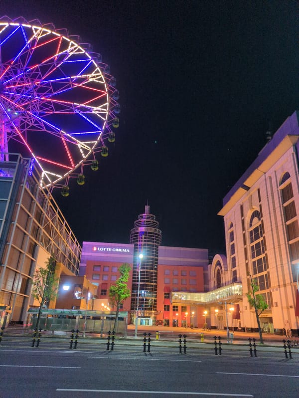 Illuminated Ferris wheel documented near Ulsan bus terminal