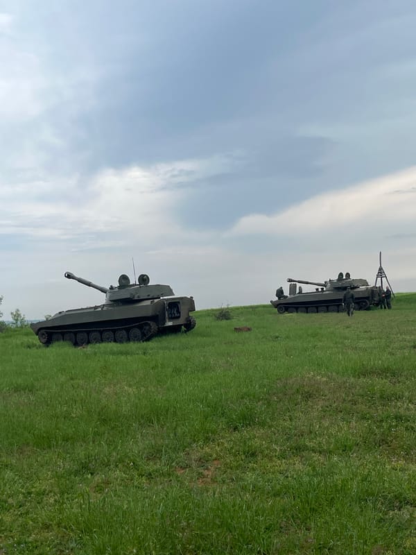 Military vehicles deployed in field near Kostena Reka, Bulgaria