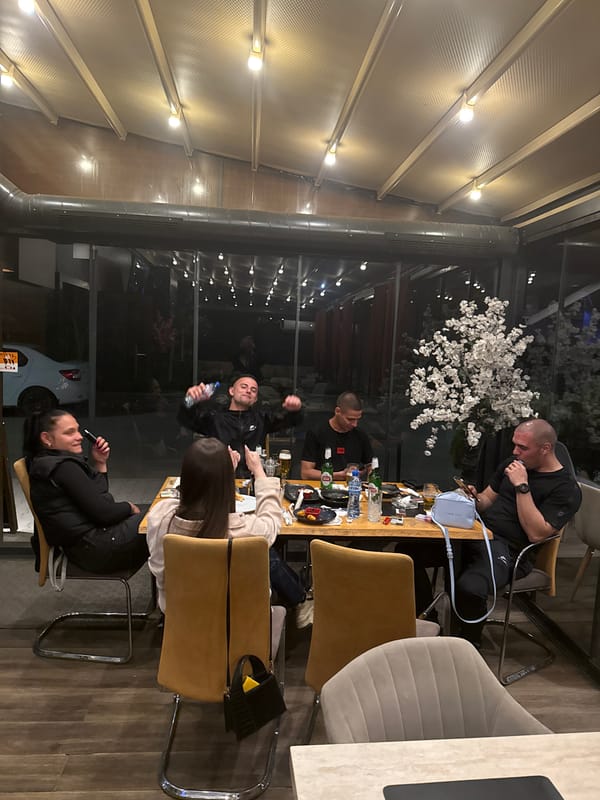 Evening dining gathering captured at outdoor restaurant