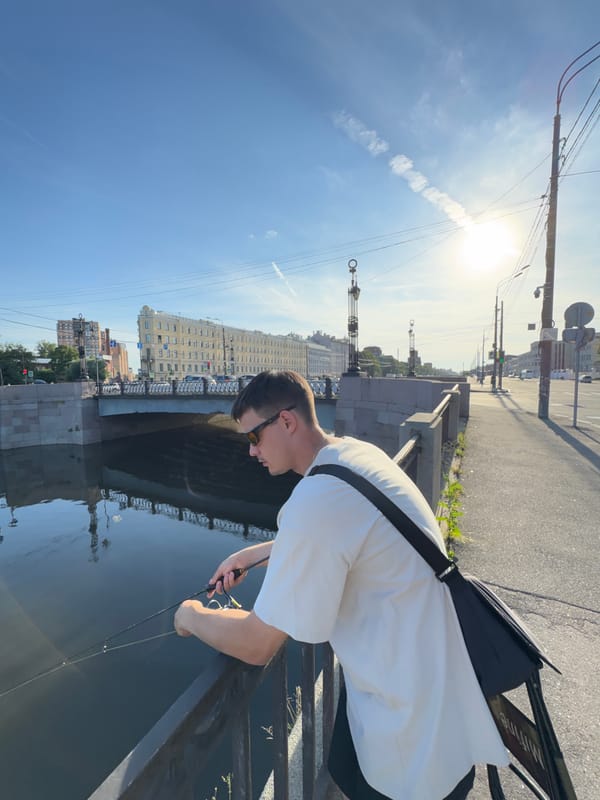 Fishing and hanging out along a Saint Petersburg canal on a sunny day