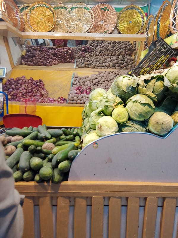Scenes from Mansehra: market produce, modern buildings, street traffic