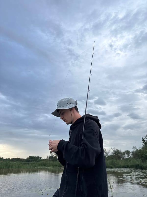 Fishing and water lilies on a grey Saint Petersburg afternoon