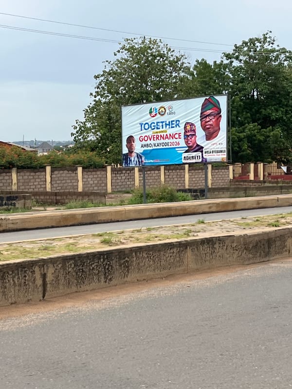 Political billboard spotted on empty road in Offatedo, Nigeria