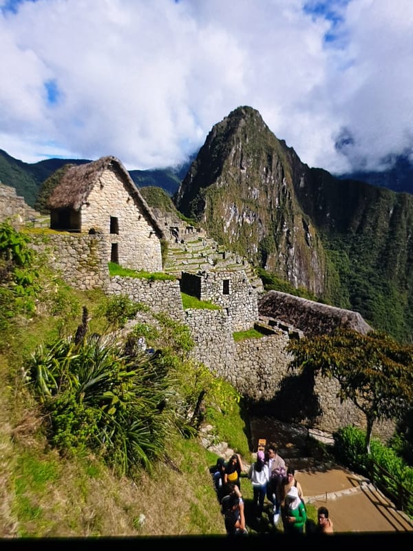Tourist documents Machu Picchu citadel views in Peru mountains