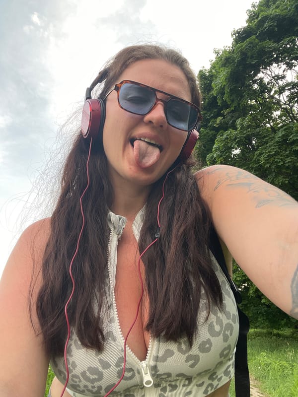 Woman takes selfie with red headphones in Lytkarino