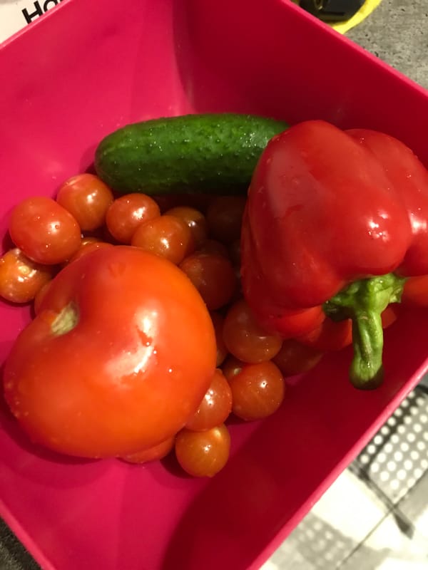 Fresh vegetables displayed in pink container in Sochi