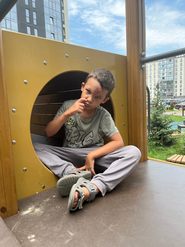 Playground moments inside a yellow tunnel and on wooden structure