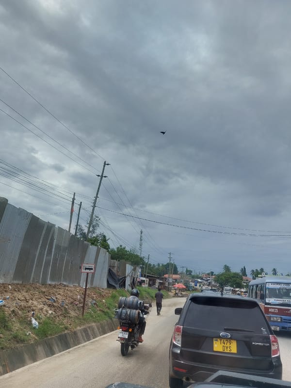Morning street scenes documented in Dar es-Salaam under overcast skies