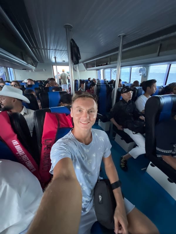 Passenger captures selfie moment aboard ferry near Denpasar