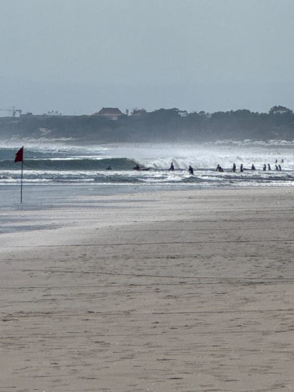 Morning surf lessons and beach activities at Kuta Beach, Bali