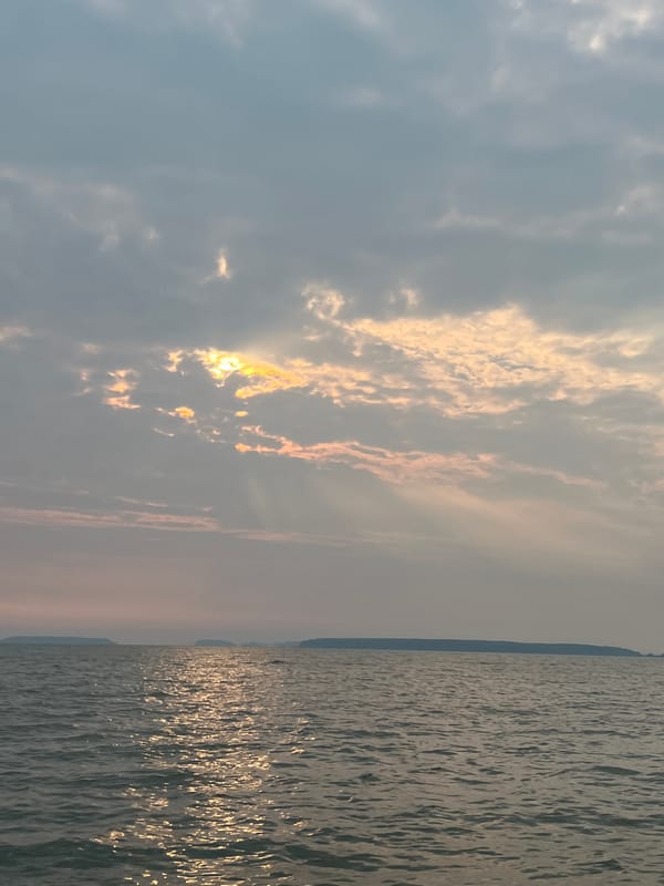 Out on the water near Novopichugovo under a breaking overcast sky