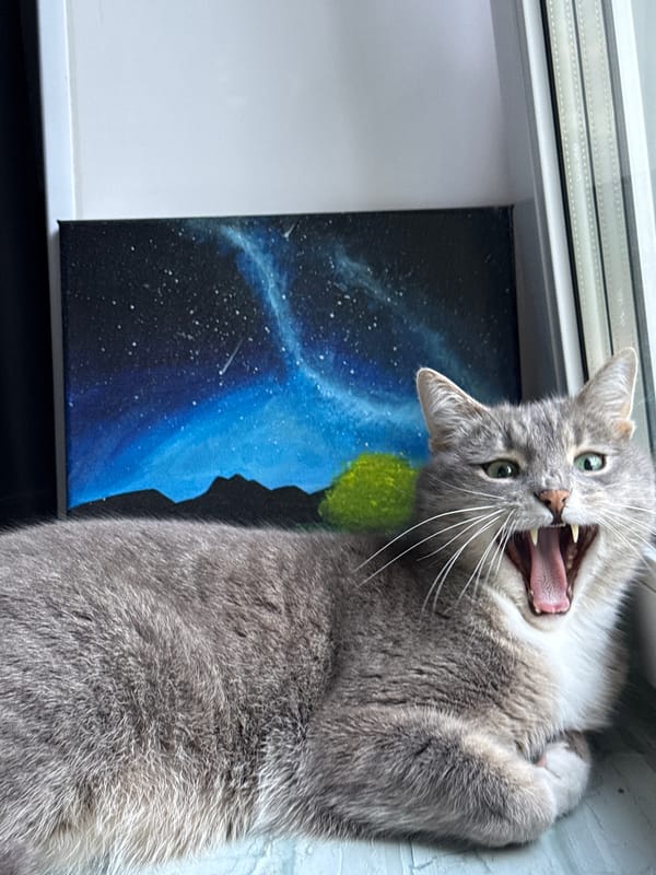 Green-eyed grey cat at home in Saratov