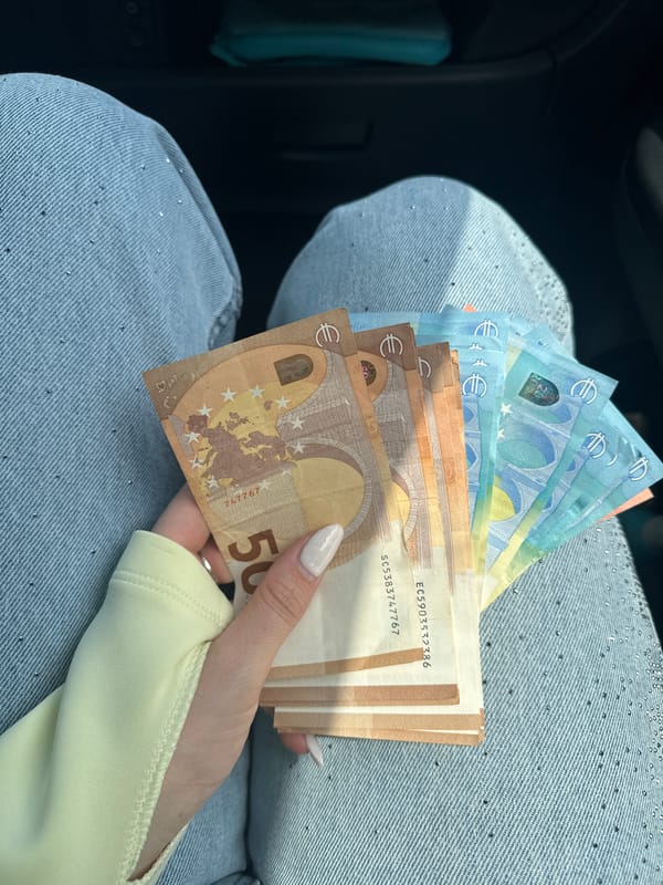 Euro cash out near a Brutalist apartment block in Plovdiv
