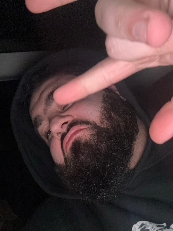 Close-up portrait captured in Yerevan showing hooded figure