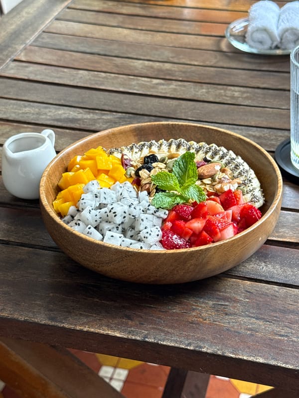 Woman enjoys fruit bowl breakfast at Đà Nẵng cafe