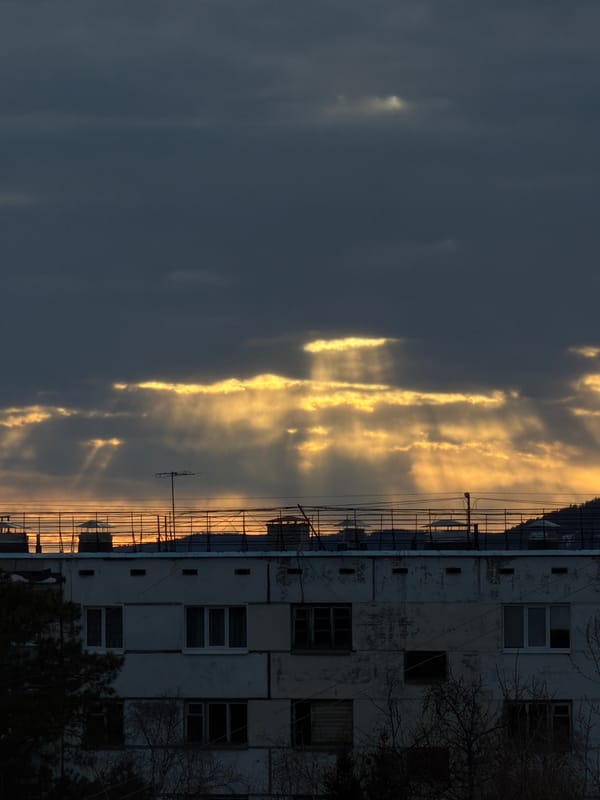 Sunlight breaks through clouds over Ust-Ilimsk apartment building