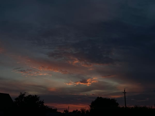Rural Russian evening documented through twilight skies and local life