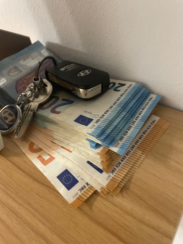 Late-night hotel check-in with cash and car keys on hand
