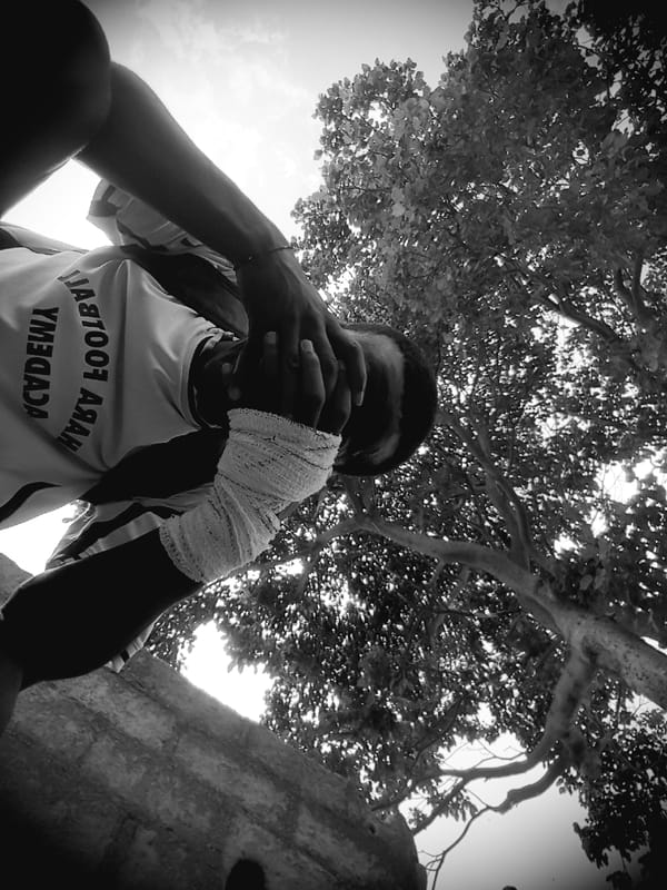 Person photographed making heart gesture in Narayi, Nigeria