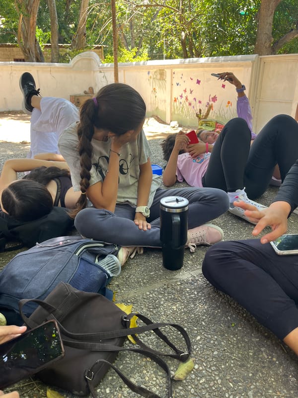 Young women gather for casual outdoor socializing in Venezuelan valley