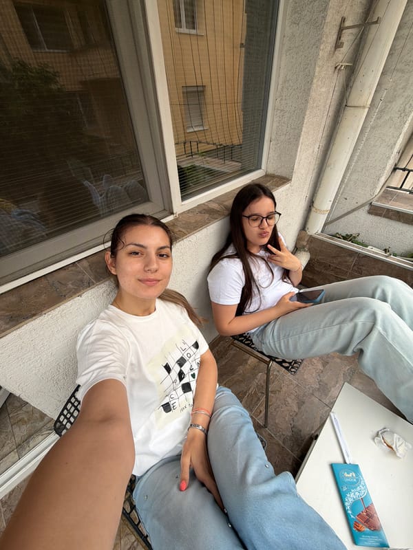 Two women relax on balcony in Burgas, Bulgaria
