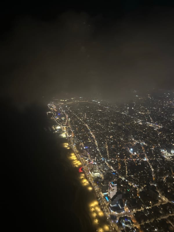Nighttime aerial view captures illuminated Tel Aviv coastline