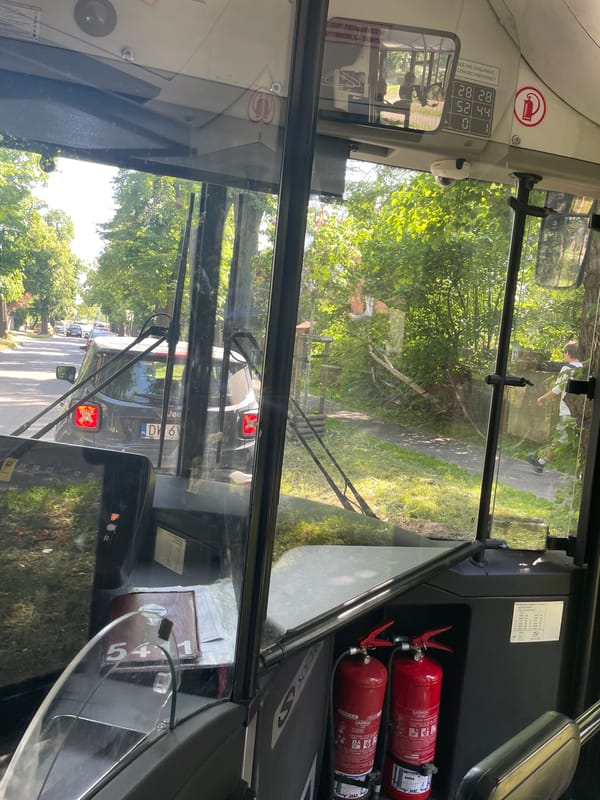 Bus passenger documents routine journey through Wrocław streets