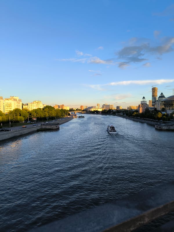 Moscow River at golden hour, bridges and boats