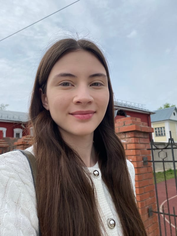 Woman takes morning selfies near cathedral in Votkinsk, Russia