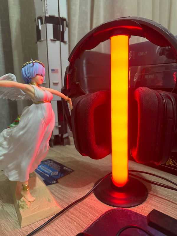 Gaming Setup Documentation Shows RGB-Lit Desk with Anime Figurine