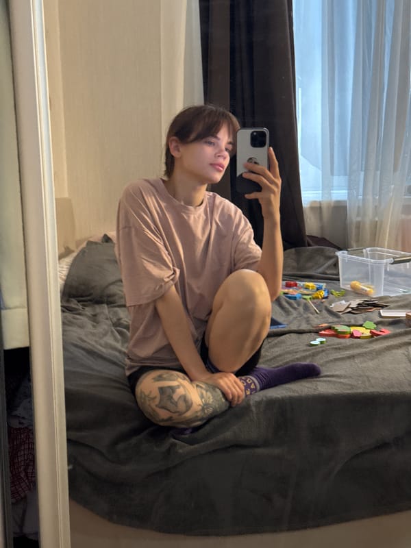 Person takes multiple selfies in bedroom in Rostov-on-Don