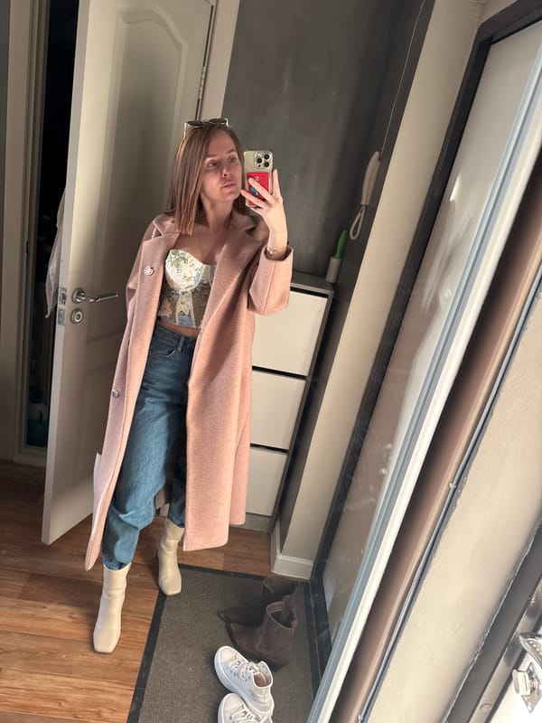 Woman takes mirror selfie in floral outfit in Perm