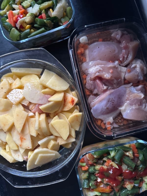 Food preparation documented in four glass dishes