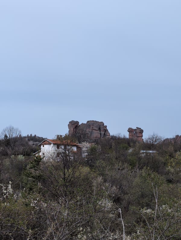 Witness documents rocky landscape with white building in Chiflik, Bulgaria