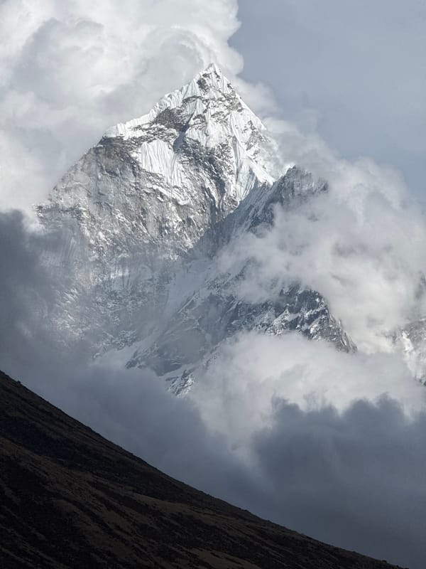 Himalayan peaks photographed through clouds near Khumjung, Nepal
