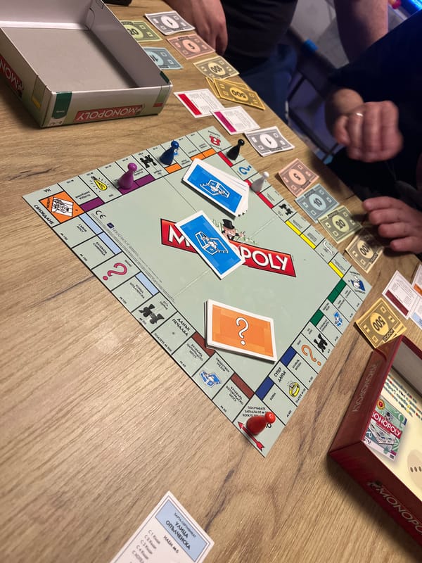 Friends toast with beer during Monopoly game in Bulgaria