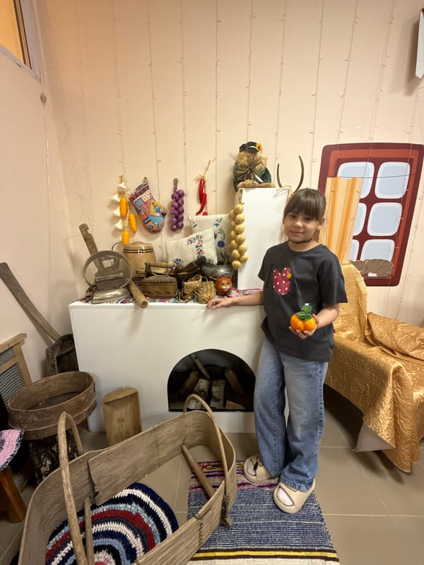 Child visits traditional Russian interior exhibit in Rusanovo museum