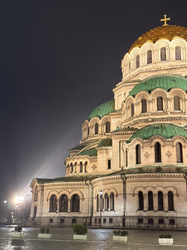 Nighttime drive through Sofia captures illuminated landmarks and streets